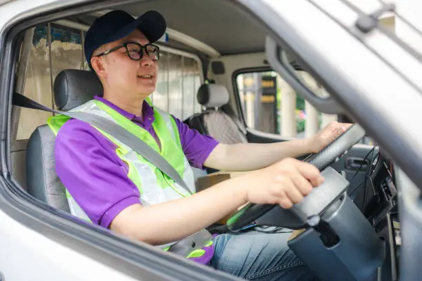 Light vehicle driver LTV driving car in city